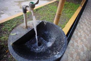 a water faucet that is flowing fast, can be used for learning to wash hands with clean wat photo