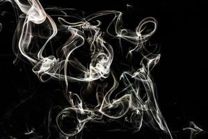 Smoke effect texture. Isolated background. Black and dark backdrop. Smokey fire and mistic effect. photo