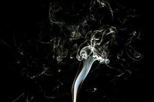 Smoke effect texture. Isolated background. Black and dark backdrop. Smokey fire and mistic effect. photo