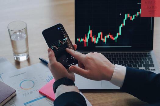 Financial graph. Businessman occupied with sells through internet. Online trading, data analysis. photo