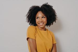 Studio shot close up portrait of casually dressed african american girl with funny face expression photo
