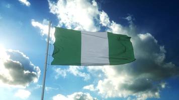 Flag of Nigeria waving at wind against beautiful blue sky. 3d illustration photo