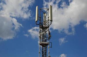 A Telecommunication antenna mast with a slightly cloudy background, France photo