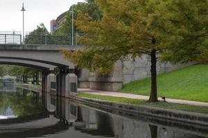 The Woodlands, Texas, USA - July 11, 2021. A view of the walking trail and one of the bridges along The Waterway. photo