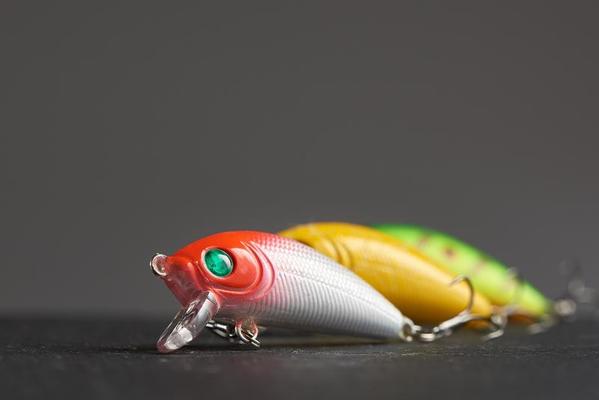 One fishing lure Wobbler closeup on the background of the other two in  blur. 11101390 Stock Photo at Vecteezy