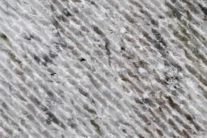 Close up view at the surface of a white marble stone. photo