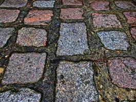 Perspective view at on old historical cobblestone roads and walkways photo