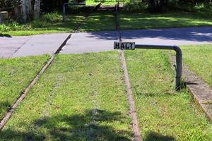 Multiple railroad tracks with junctions at a railway station in a perspective and birds view photo