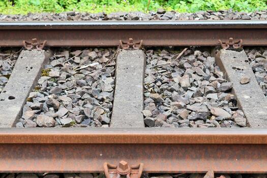 Multiple railroad tracks with junctions at a railway station in a perspective and birds view photo