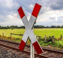 Multiple railroad tracks with junctions at a railway station in a perspective and birds view photo