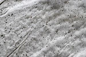 Close up view at the surface of a white marble stone. photo