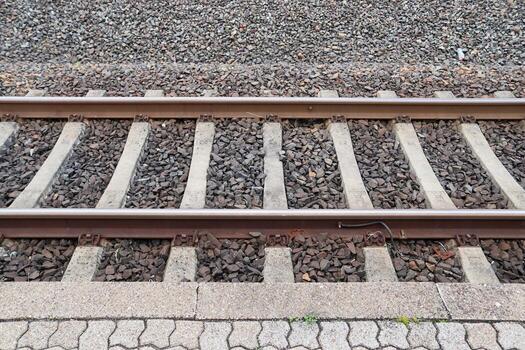 Multiple railroad tracks with junctions at a railway station in a perspective and birds view photo