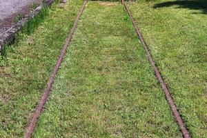 Multiple railroad tracks with junctions at a railway station in a perspective and birds view photo