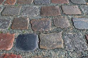 Perspective view at on old historical cobblestone roads and walkways photo