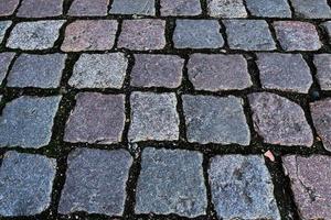 Perspective view at on old historical cobblestone roads and walkways photo