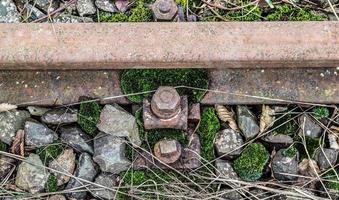 Multiple railroad tracks with junctions at a railway station in a perspective and birds view photo