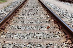 Multiple railroad tracks with junctions at a railway station in a perspective and birds view photo