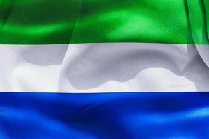 Ilustración 3d de una bandera de sierra leona - bandera de tela ondeante realista foto