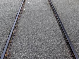 Multiple railroad tracks with junctions at a railway station in a perspective and birds view photo