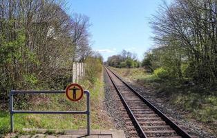 Multiple railroad tracks with junctions at a railway station in a perspective and birds view photo