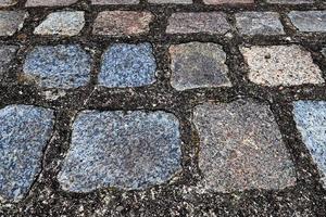 Perspective view at on old historical cobblestone roads and walkways photo