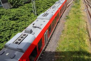 Multiple railroad tracks with junctions at a railway station in a perspective and birds view photo