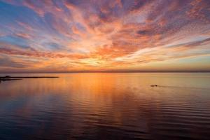 Pier on Mobile Bay at sunset photo