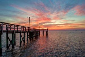 Pier on Mobile Bay at sunset photo