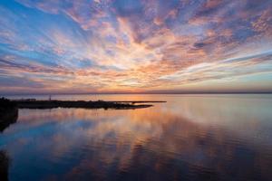 Pier on Mobile Bay at sunset photo