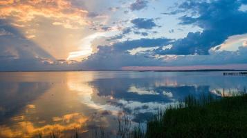 Pier on Mobile Bay at sunset photo