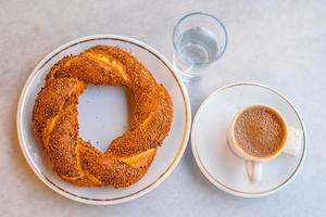 Turkish traditional bagel simit with Turkish coffee in Istanbul photo