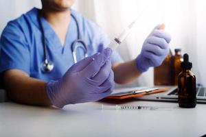 Medicine doctor hand working on a patients x-ray scans digital healthcare and connection with modern virtual screen interface icons, Medical technology and network concept. photo