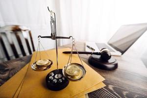 justice and law concept.Male judge in a courtroom on wooden table and Counselor or Male lawyer working in office. Legal law, advice and justice concept. photo