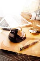 Business and lawyers discussing contract papers with brass scale on desk in office. Law, legal services, advice, justice and law concept picture with film grain effect photo