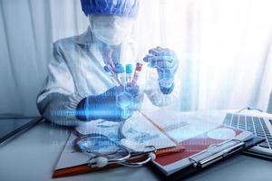 Medicine doctor hand working on a patients x-ray scans digital healthcare and connection with modern virtual screen interface icons, Medical technology and network concept. photo