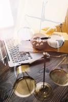 Business and lawyers discussing contract papers with brass scale on desk in office. Law, legal services, advice, justice and law concept picture with film grain effect photo