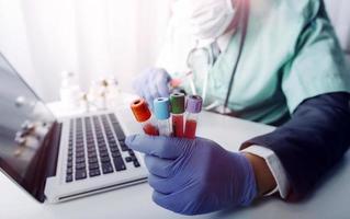 Medicine doctor hand working on a patients x-ray scans digital healthcare and connection with modern virtual screen interface icons, Medical technology and network concept. photo
