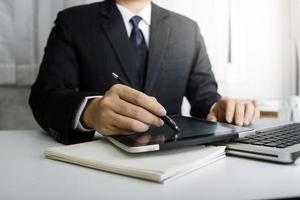 Business and lawyers discussing contract papers with brass scale on desk in office. Law, legal services, advice, justice and law concept picture with film grain effect photo