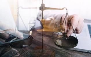 Business and lawyers discussing contract papers with brass scale on desk in office. Law, legal services, advice, justice and law concept picture with film grain effect photo