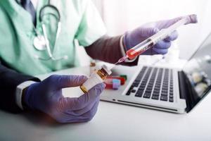 Medicine doctor hand working on a patients x-ray scans digital healthcare and connection with modern virtual screen interface icons, Medical technology and network concept. photo