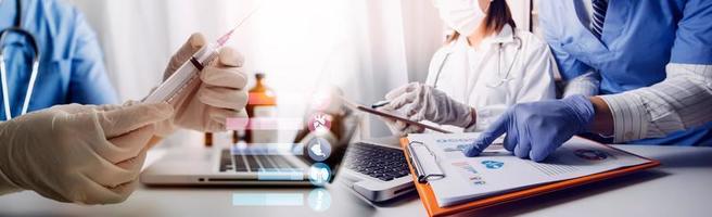 Medicine doctor hand working on a patients x-ray scans digital healthcare and connection with modern virtual screen interface icons, Medical technology and network concept. photo