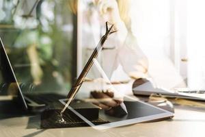 Business and lawyers discussing contract papers with brass scale on desk in office. Law, legal services, advice, justice and law concept picture with film grain effect photo