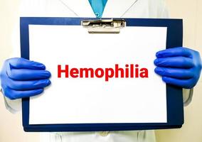 Medical term Hemophilia on clip board, health and medical conceptual image. photo