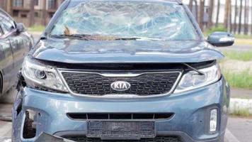 Car riddled with bullets. War in Ukraine. Shot car of civilians while trying to evacuate from the combat zone in the Kyiv region. Traces of bullets in the back of a car. Ukraine, Irpin - May 12, 2022. video