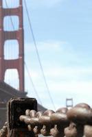 Rusty chain with Golden Gate Bridge in the background photo