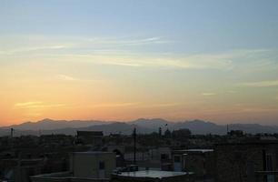 The sun sets in the desert - Yazd, Iran photo
