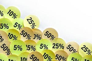 Large amount of stickers with yellow percentage values for black friday or cyber monday sale. Abstract image of discount prices photo