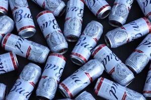 Many Cans of Budweiser Lager Alcohol Beer - Budweiser is a Brand from Anheuser-Busch Inbev photo