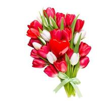 Springt time. Red tulip bouquet on the white wooden background. photo