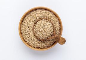 Bio natural sesame seeds on wooden bowl. photo